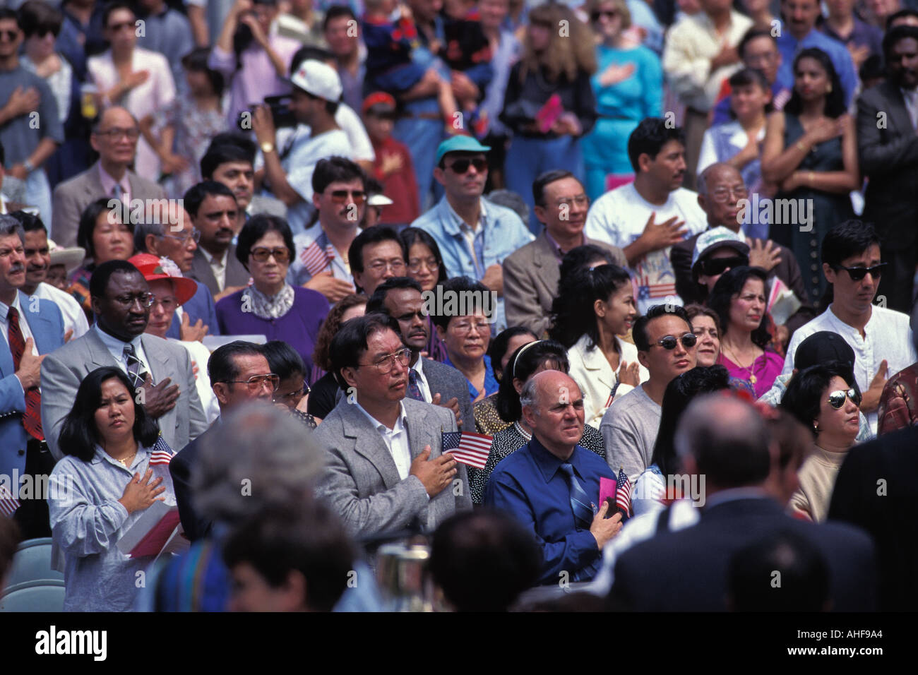 Crowd Of Immigrants Repeat Pledge Of Allegiance During 4th Of July U S Naturalization Ceremony Seattle Washington Stock Photo