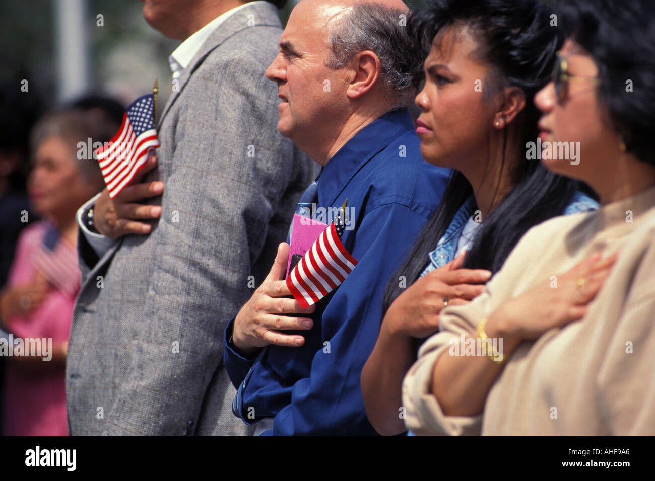 Group Of Immigrants Repeat Pledge Of Allegiance During 4th Of July U S Naturalization Ceremony Seattle Washington Stock Photo