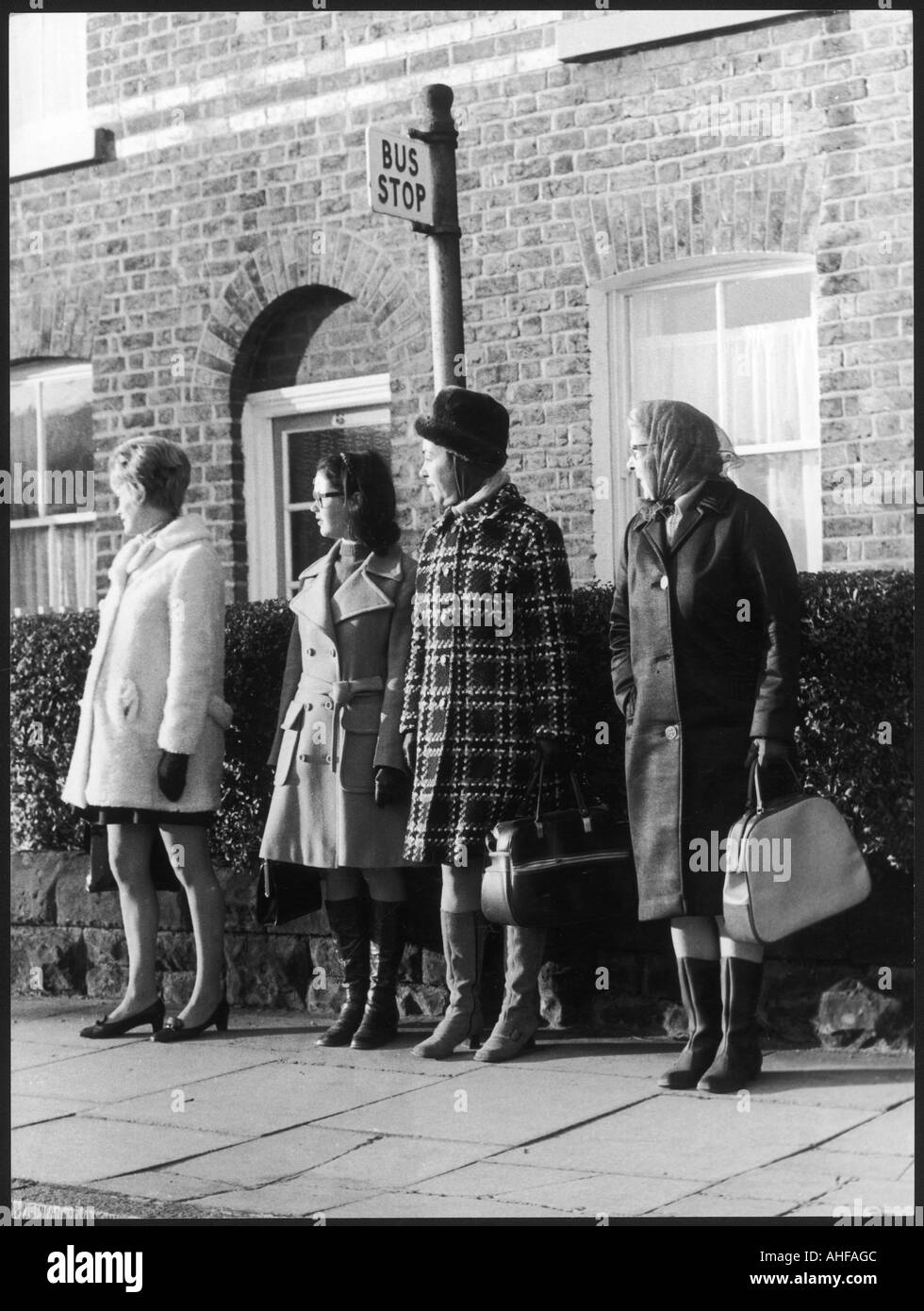 Bus Stop Queue 1960s Stock Photo Alamy