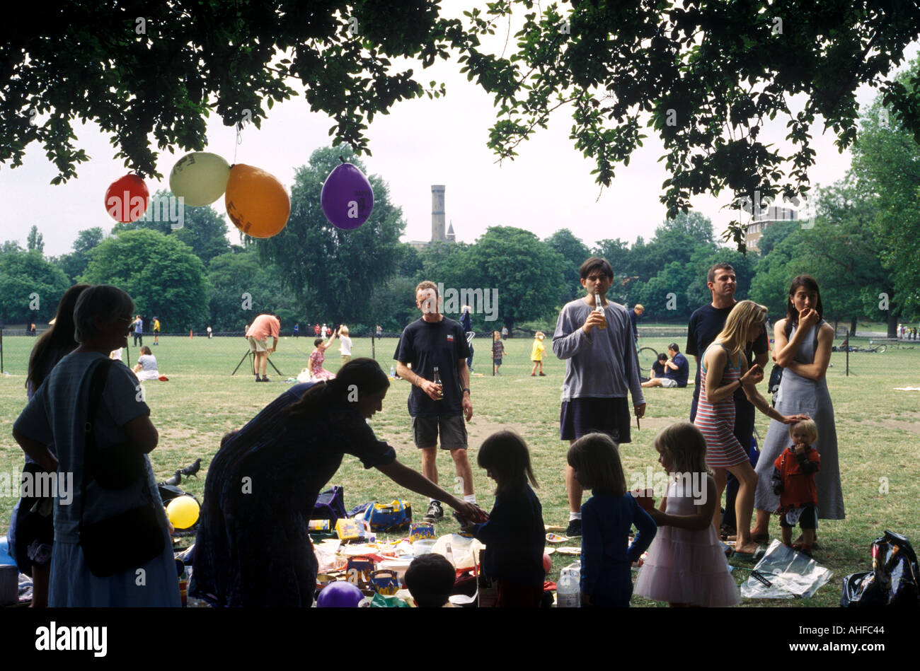 Families and friends at a young girl s birthday party, Clissold Park, London, UK. Stock Photo