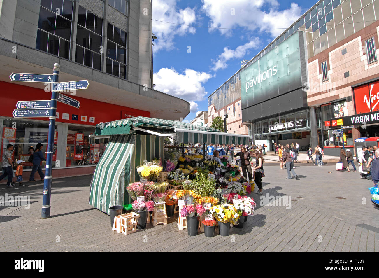 Busy street scene in Birmingham city centre. A summer afternoon showing