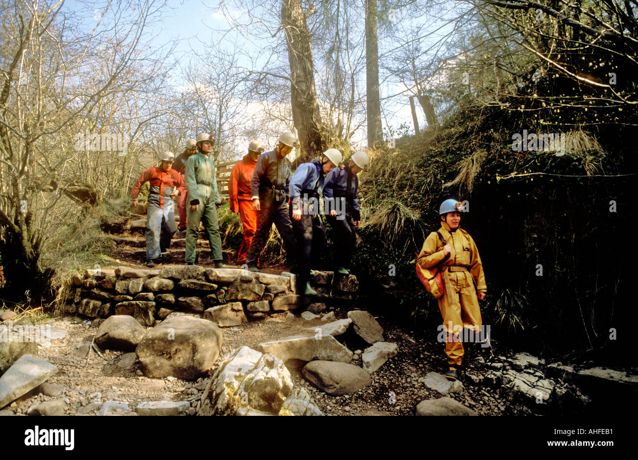 Outdoor pursuits group under instruction walking to cave Porth yr Ogof