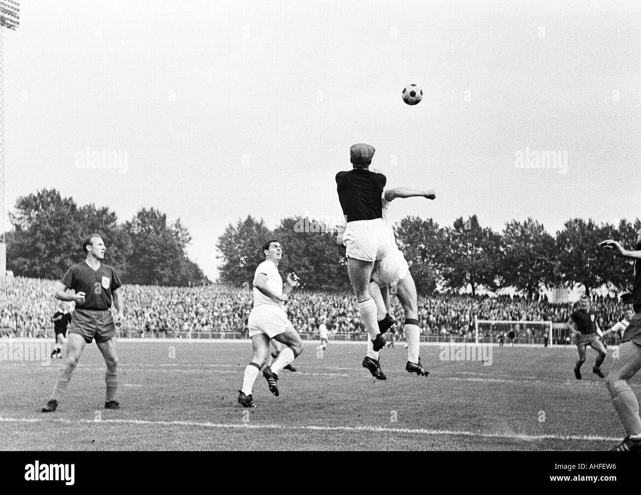football, Regionalliga West, 1965/1966, Fortuna Duesseldorf versus Wuppertaler SV 2:1, Rhein Stadium in Duesseldorf, scene of the match, f.l.t.r. Erich Haase (WSV), Peter Meyer (Ddorf), keeper Dieter Auris (WSV), Manfred Reichert (WSV) Stock Photo