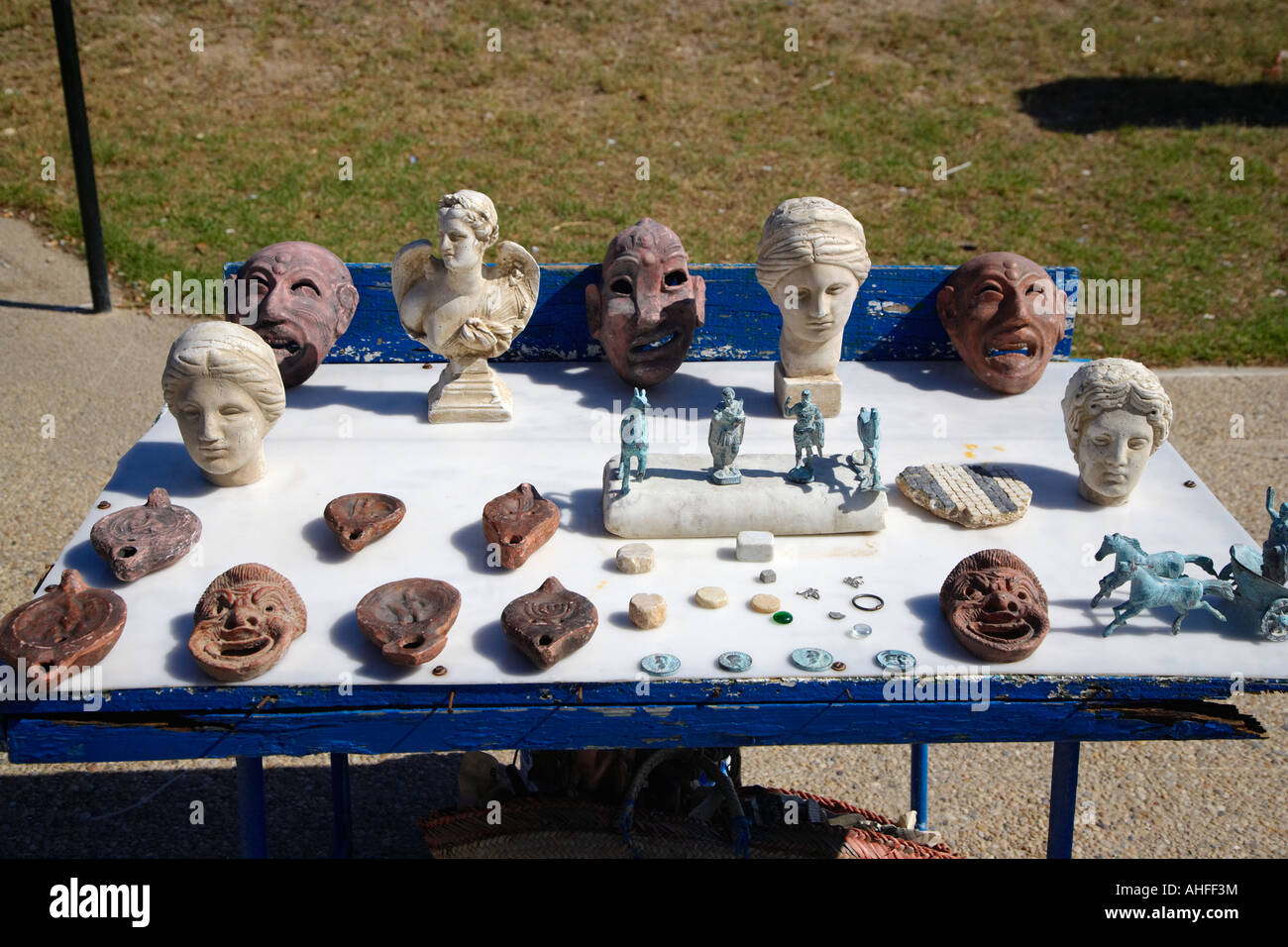Masks and Statues for sale at the Antique Theatre in Carthage, Tunisia Stock Photo