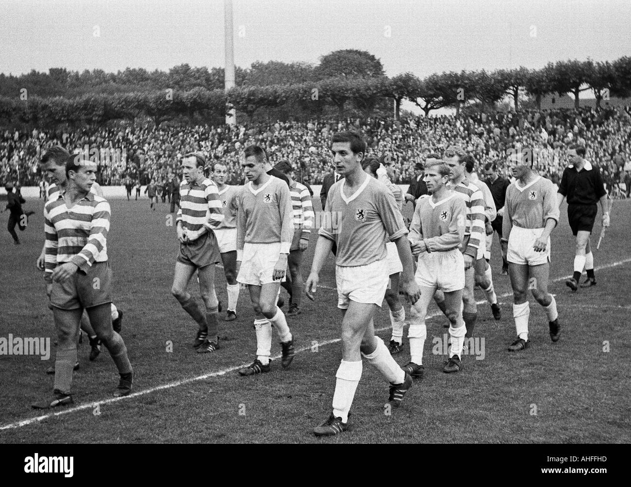 football, Bundesliga, 1965/1966, Wedau Stadium in Duisburg, Meidericher SV versus TSV 1860 Munich 2:3, football players leaving the pitch, f.l.t.r. Guenter Preuss (MSV), Johann Sabath (MSV), Horst Gecks (MSV), Rudolf Brunnenmeier (1860), Friedhelm Konietz Stock Photo