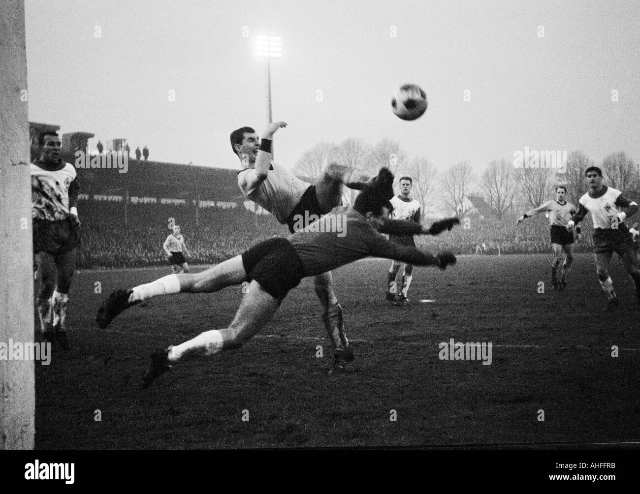 football, Bundesliga, 1965/1966, Stadium Rote Erde in Dortmund, Borussia Dortmund versus SV Werder Bremen 2:1, scene of the match, f.l.t.r. Horst Dieter Hoettges (Bremen), Lothar Emmerich (BVB), keeper Guenter Bernhard (Bremen), Hans Schulz (Bremen), Wolf Stock Photo