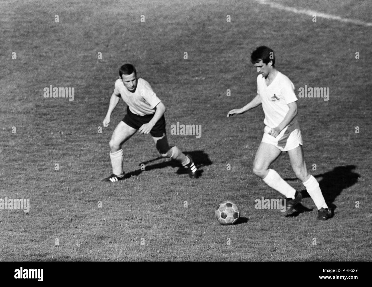 football, Bundesliga, 1965/1966, Borussia Dortmund versus 1. FC Cologne 3:2, Stadium Rote Erde, scene of the match, Dieter Kurrat (BVB, left) and Wolfgang Overath (Koeln) right Stock Photo