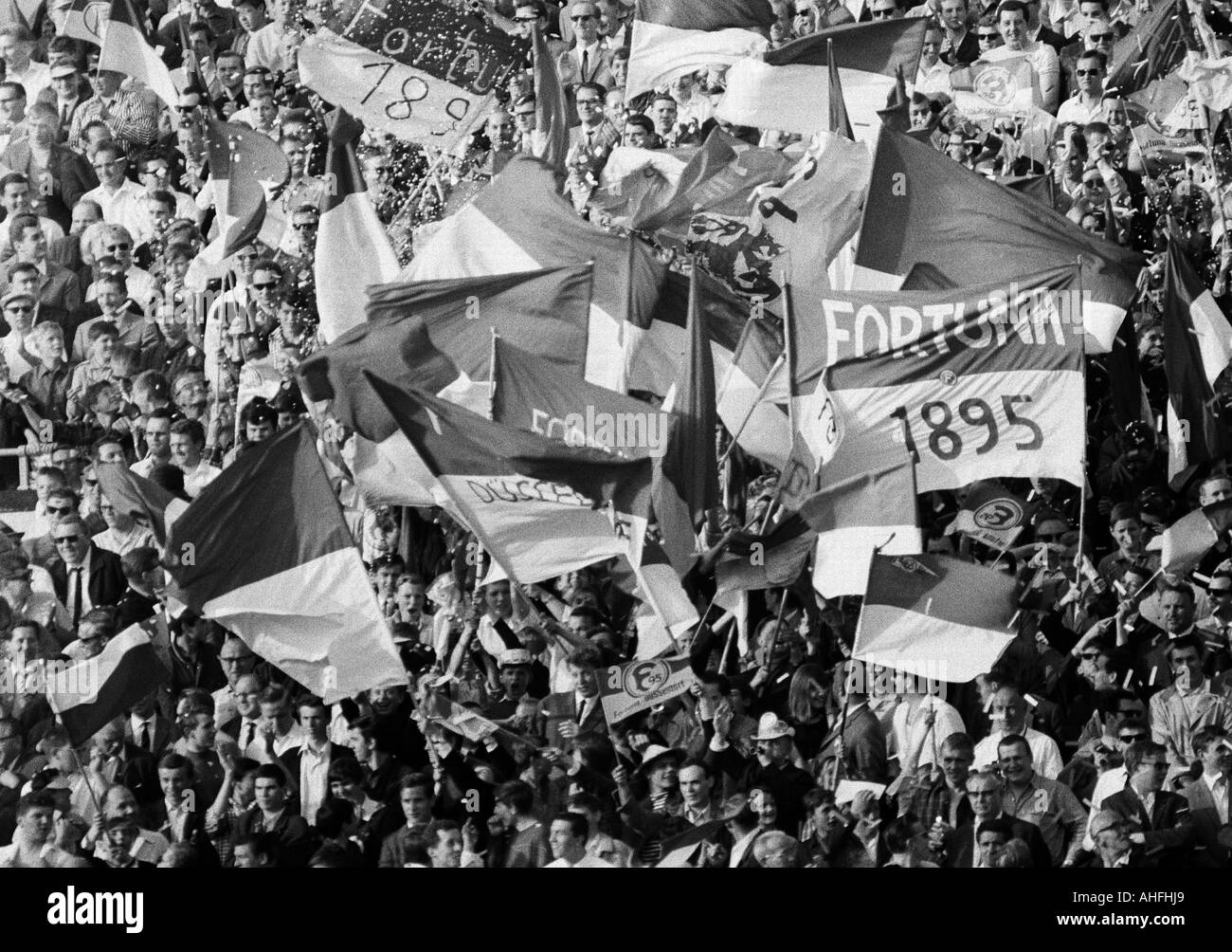 football, Regionalliga, 1965/1966, promotion match to the Bundesliga 1966/1967, Fortuna Duesseldorf versus Kickers Offenbach 2:0, Rhein Stadium in Duesseldorf, rejoicing Duesseldorf football fans waving flags with club colours Stock Photo