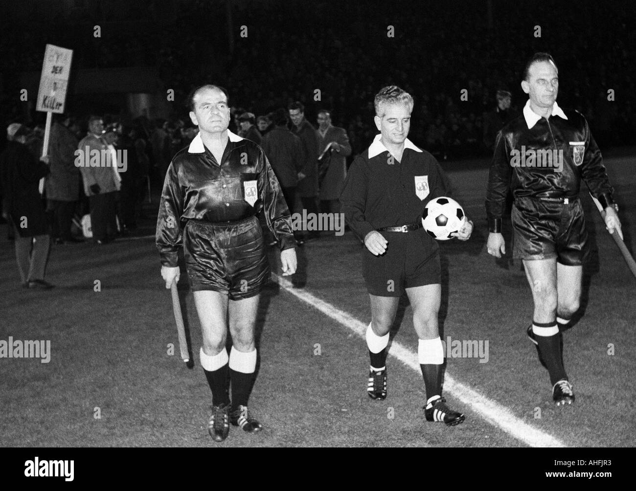 football, European Cup Winners Cup, 1966/1967, eighth final, return leg, Borussia Dortmund versus Glasgow Rangers 0:0, Stadium Rote Erde in Dortmund, match officials come in the stadium, referee Romantschev from Bulgaria (with ball), left and right the re Stock Photo