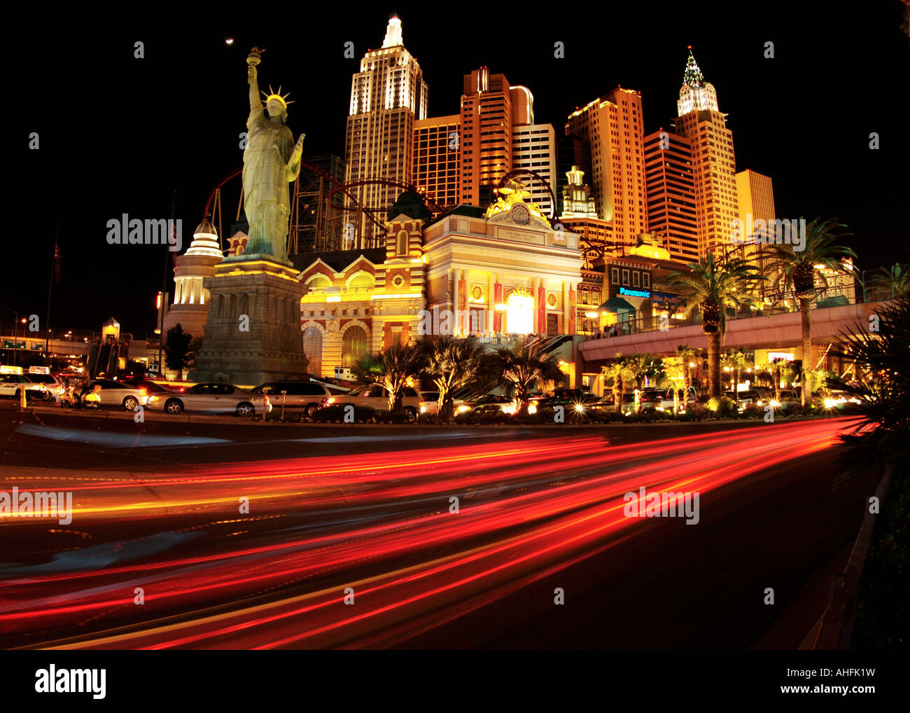 Car tail lights zoom along the strip past New York New York hotel and casino Las Vegas Stock Photo