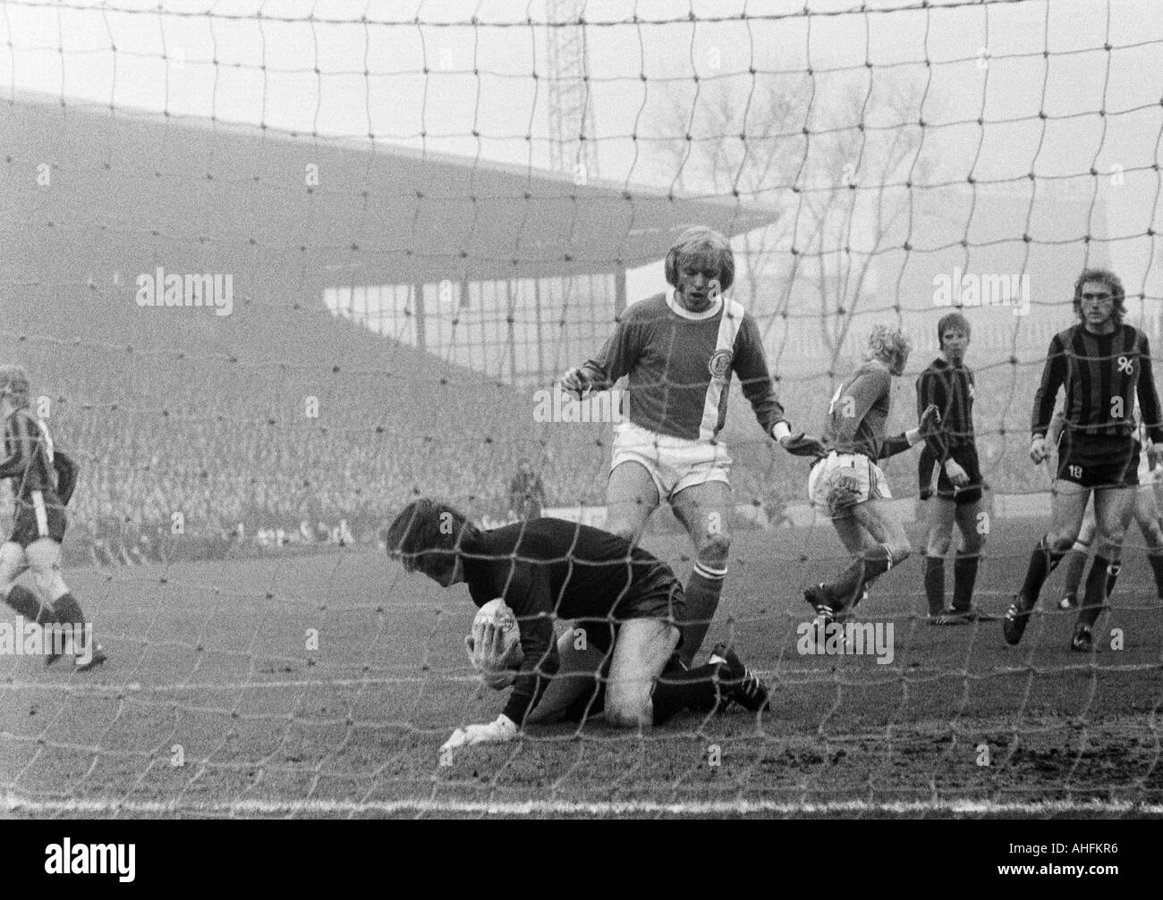 football, Bundesliga, 1971/1972, FC Schalke 04 versus Hanover 96 5:0, Stadium Glueckaufkampfbahn in Gelsenkirchen, scene of the match, f.l.t.r. keeper Franz Josef Pauly (96), Klaus Scheer (S04), Rolf Ruessmann (S04), Peter Anders (96), Peter Ruehmkorb (96 Stock Photo