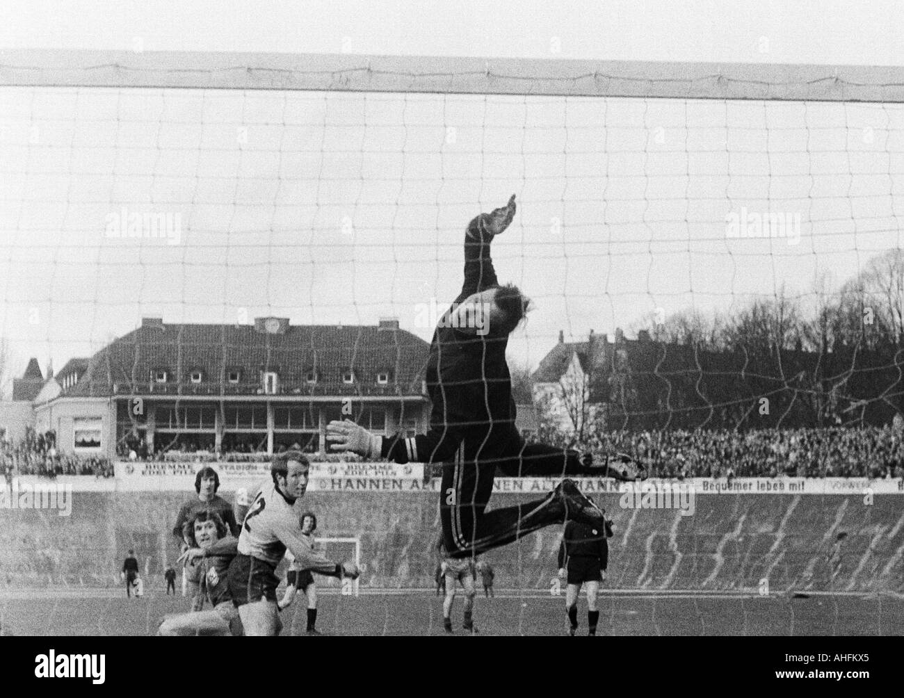 football, Regionalliga West, 1971/1972, Stadium am Zoo in Wuppertal, Wuppertaler SV versus Alemannia Aix-La-Chapelle 5:0, scene of the match, f.l.t.r. Guenter Proepper (WSV), Gustav Jung (WSV) behind, Christoph Walter (Aachen), keeper Werner Scholz (Aache Stock Photo