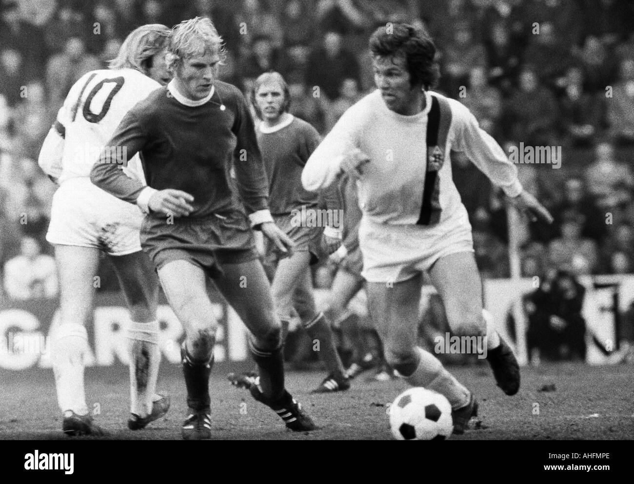football, DFB Cup, quarter final, first leg, 1971/1972, Borussia Moenchengladbach versus Schalke 04 2:2, Boekelberg Stadium in Moenchengladbach, scene of the match, f.l.t.r. Guenter Netzer (MG, 10), Rolf Ruessmann (S04), Klaus Scheer (S04), Jupp Heynckes Stock Photo