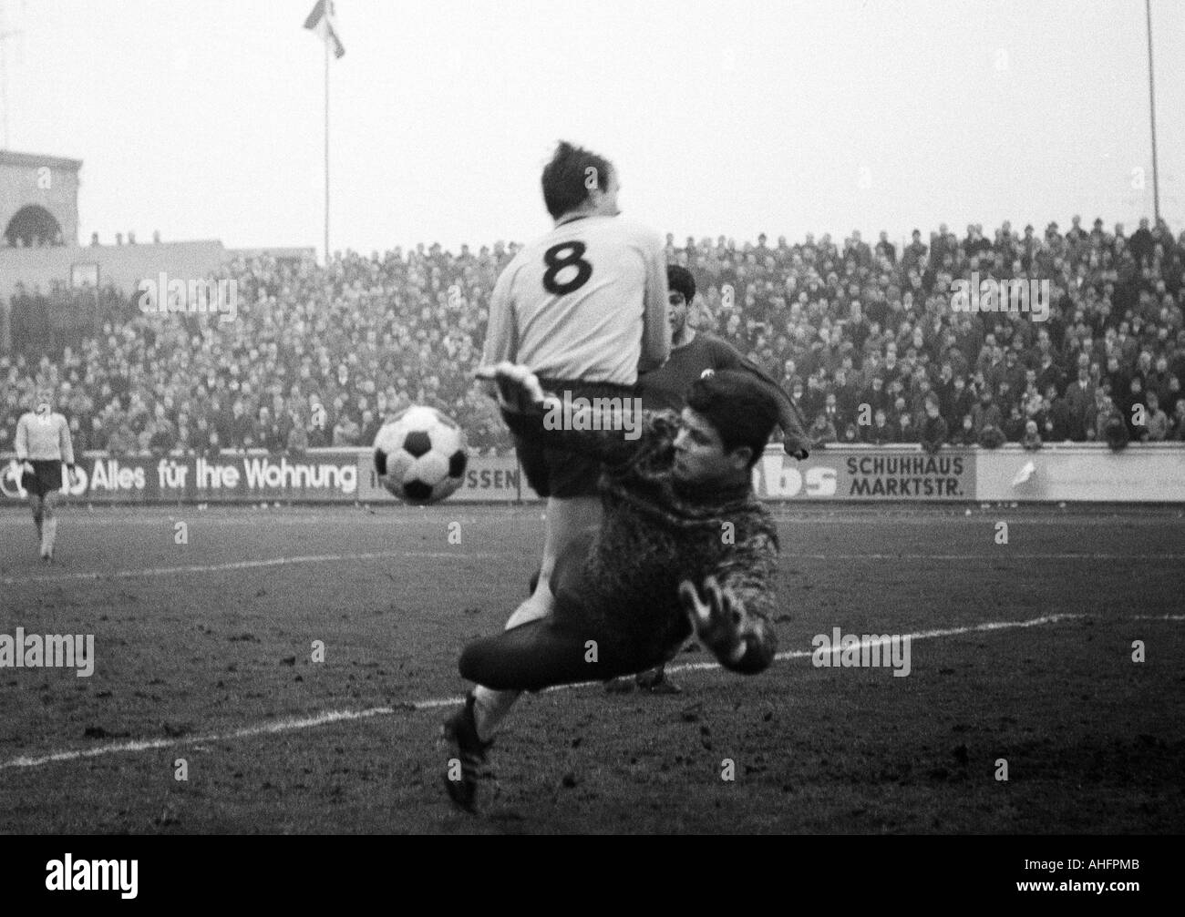 football, friendly game, 1967, Niederrhein Stadium in Oberhausen, Rot-Weiss Oberhausen versus Borussia Dortmund 4:2, scene of the match, f.l.t.r. Reinhold Wosab (BVB, 8), Reza Adelkhani (RWO, covered), save by keeper Wolfgang Scheid (RWO) Stock Photo