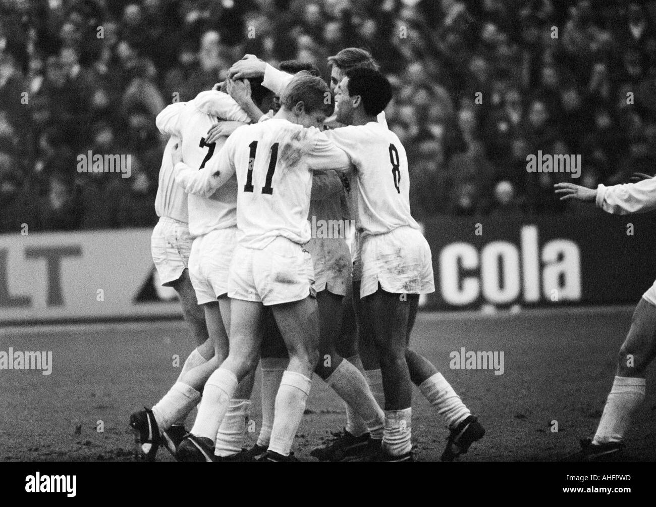 football, Bundesliga, 1967/1968, Wedau Stadium in Duisburg, MSV Duisburg versus Borussia Moenchengladbach 2:2, Gladbach players rejoicing at the 0:2 goal, f.l.t.r. goal scorer Herbert Wimmer (7), Klaus Ackermann (11), Manfred Kempers (behind covered), Wer Stock Photo