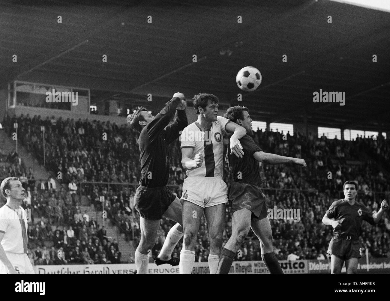 football, Bundesliga, 1967/1968, Borussia Moenchengladbach versus Karlsruher SC 0:0, Boekelberg Stadium, scene of the match, f.l.t.r. Josef Marx, keeper Siegfried Kessler, Juergen Weidlandt (all Karlsruhe), Herbert Laumen, Peter Dietrich (both Gladbach) Stock Photo