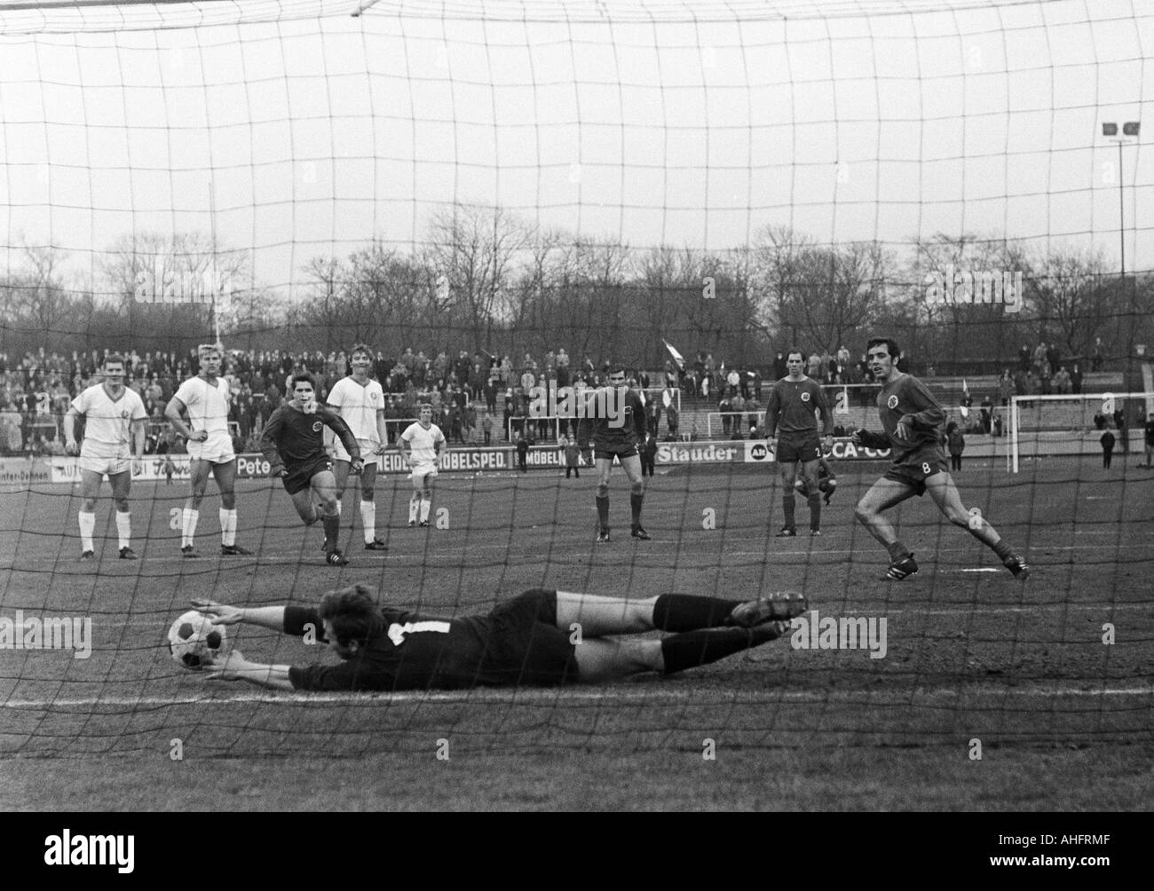 football, Regionalliga West, 1967/1968, Rot-Weiss Oberhausen versus TSV Marl-Huels 3:1, Niederrhein Stadium in Oberhausen, scene of the match, keeper Georg Marwig (Marl) saves a foul penalty shot by Franz Krauthausen (RWO) right, behind f.l.t.r. Hans Diet Stock Photo