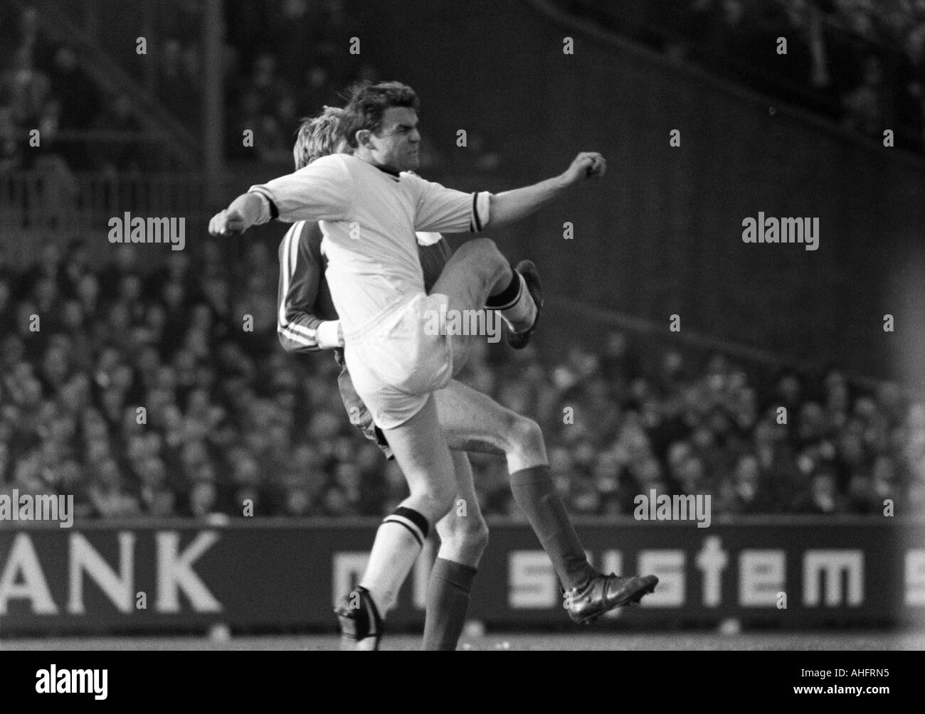 football, DFB Cup, quarter final, 1967/1968, Ruhr Stadium in Bochum, VfL Bochum versus Borussia Moenchengladbach 2:0, scene of the match, duel between Herbert Laumen (MG) ahead and a Bochum player Stock Photo
