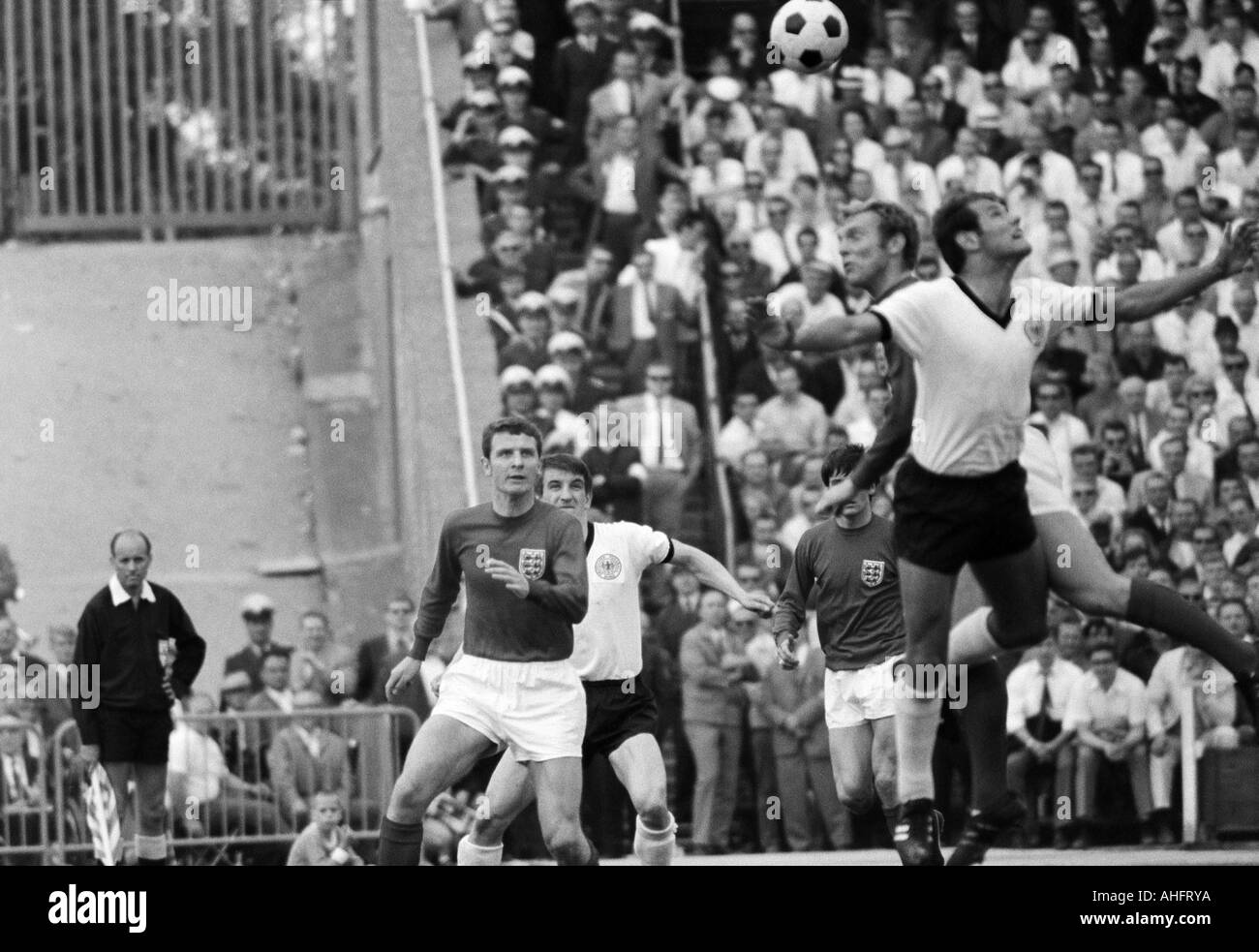 football, international match, 1968, Niedersachsen Stadium in Hanover, Germany versus England 1:0, scene of the match, f.l.t.r. Brian Labone (England), Hennes Loehr (FRG), Bobby Moore (England) in a header duel with Georg Volkert (FRG) Stock Photo