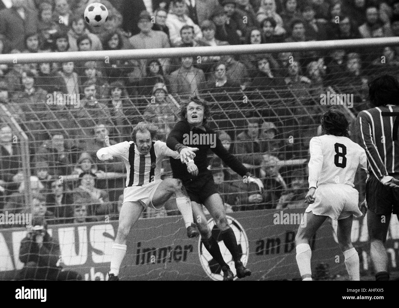 football, Bundesliga, 1972/1973, Borussia Moenchengladbach versus FC Bayern Munich 0:3, Boekelberg Stadium, scene of the match, keeper Sepp Maier (FCB) saves before Bernd Rupp (MG) left Stock Photo