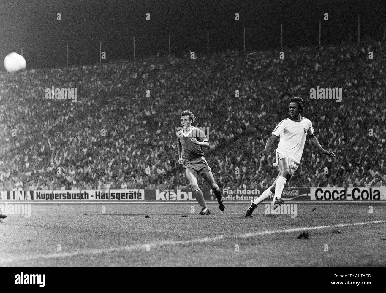 football, Bundesliga, 1973/1974, FC Schalke 04 versus VfL Bochum 3:1, Park Stadium in Gelsenkirchen, scene of the match, cross by Heinz Werner Eggeling (Bochum) right, in the middle Ruediger Abramczik (S04) Stock Photo