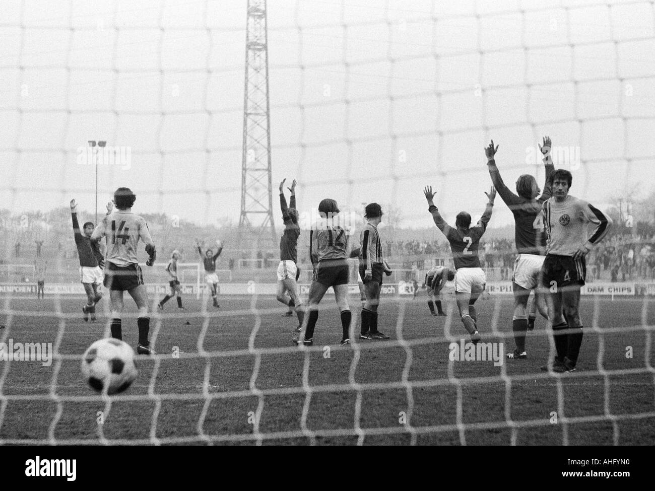football, Regionalliga West, 1973/1974, Niederrhein Stadium in Oberhausen, Rot-Weiss Oberhausen versus Alemannia Aix-La-Chapelle 3:2, football players, 3:2 winning goal to Oberhausen by goal scorer Ditmar Jakobs (RWO) 5.f.l., Hermann Josef Wilbertz (RWO, Stock Photo