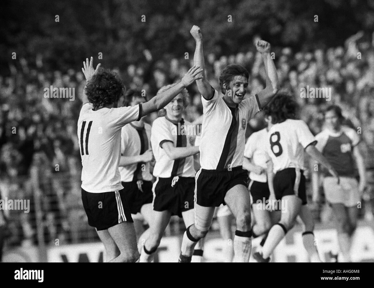 football, Regionalliga 1973/1974, promotion match to the Bundesliga 1974/1975, SG Wattenscheid 09 versus Wacker 04 Berlin 1:1, Lohrheide Stadium in Bochum-Wattenscheid, rejoicing football players, 1:0 goal to Wattenscheid by an overhead kick, f.l.t.r. Det Stock Photo