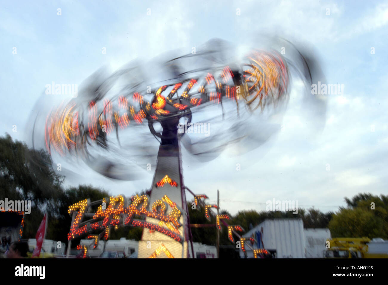Zipper carnival ride in motion Stock Photo