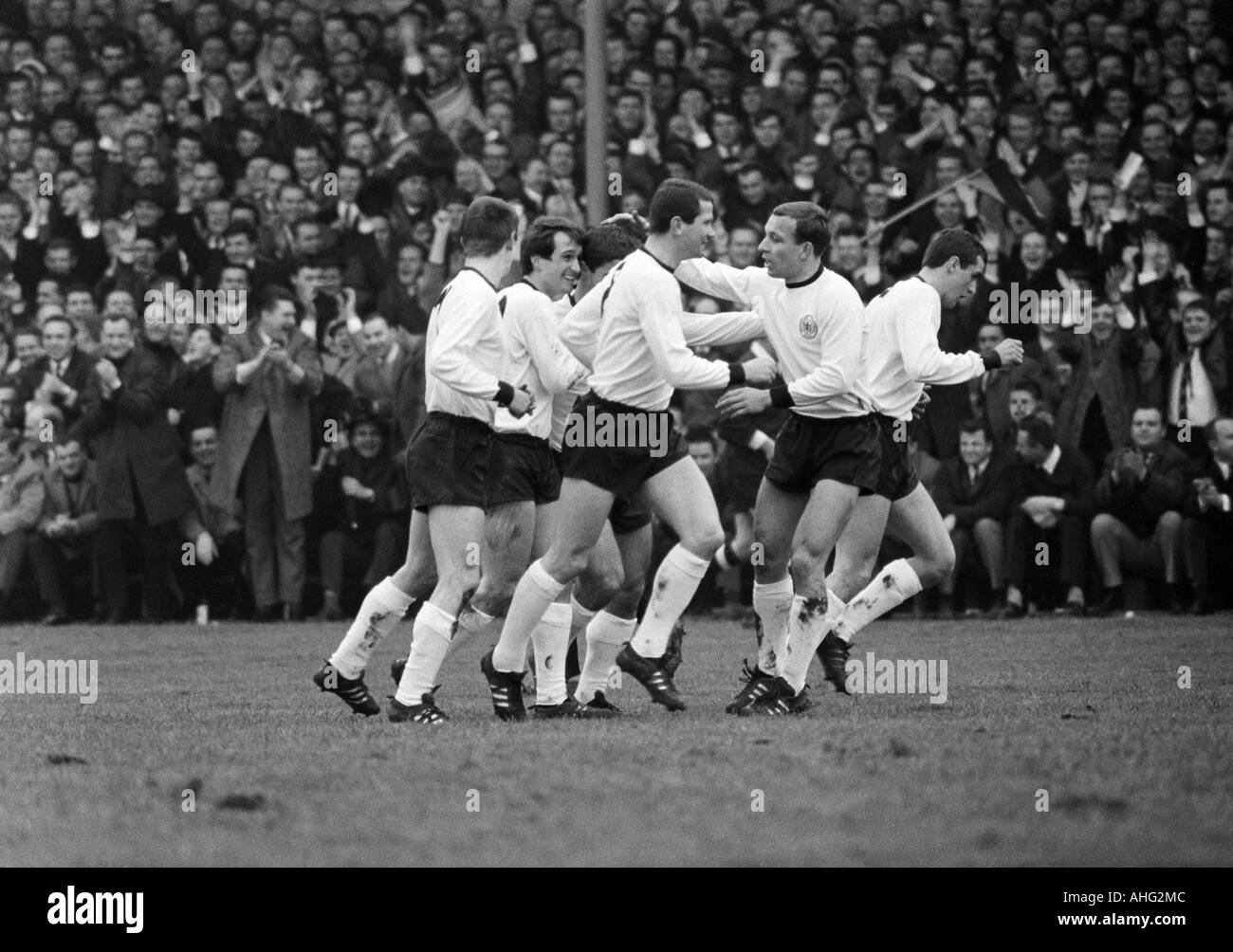 football, European championship 1968, qualifying round, group 4, Stadium Rote Erde in Dortmund, 1967, Germany against Albania 6:0, scene of the match, FRG players rejoicing at a goal, f.l.t.r. Wolfgang Overath (2.f.l.), Lothar Ulsass, Horst Dieter Hoettge Stock Photo