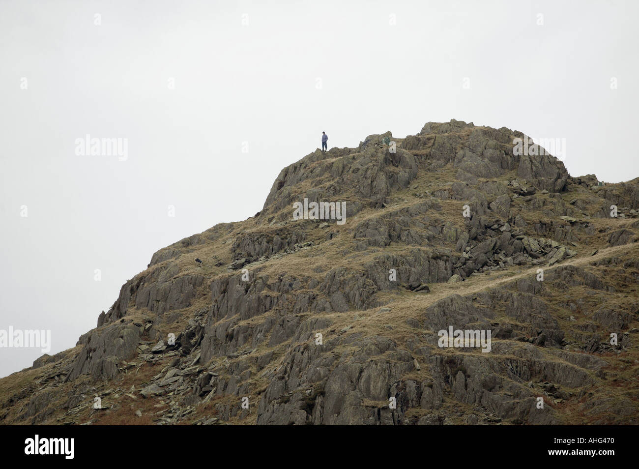 A climber high on a peak in the Duddon Valley Cumbria Enland UK Stock Photo