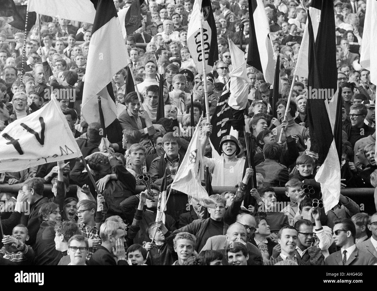 football, Bundesliga, 1967/1968, Borussia Moenchengladbach versus 1. FC Kaiserslautern 8:2, Boekelberg Stadium, crowd of spectators, Gladbach fans waving the club flags Stock Photo