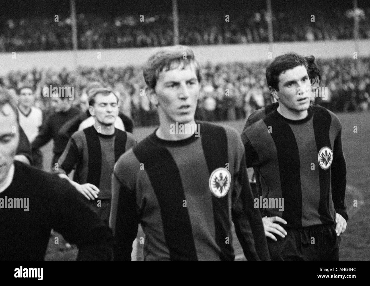 football, Bundesliga, 1967/1968, Borussia Dortmund versus Eintracht Frankfurt 2:1, Stadium Rote Erde in Dortmund, football players leaving the pitch, f.l.t.r. Helmut Kraus, Juergen Grabowski, Heiko Racky (all Frankfurt) Stock Photo