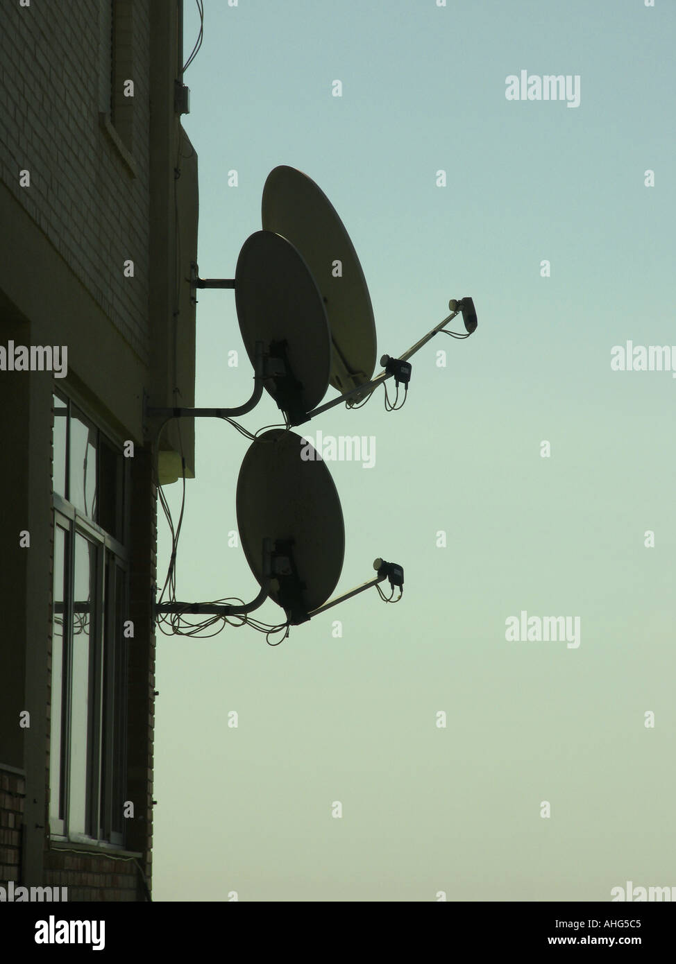 Satellite dishes on building Stock Photo