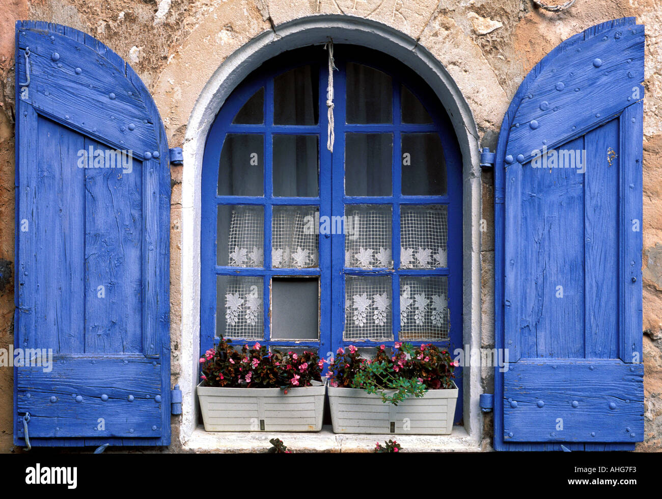 Window with blinds opened.Rustrel village.Provence. Stock Photo
