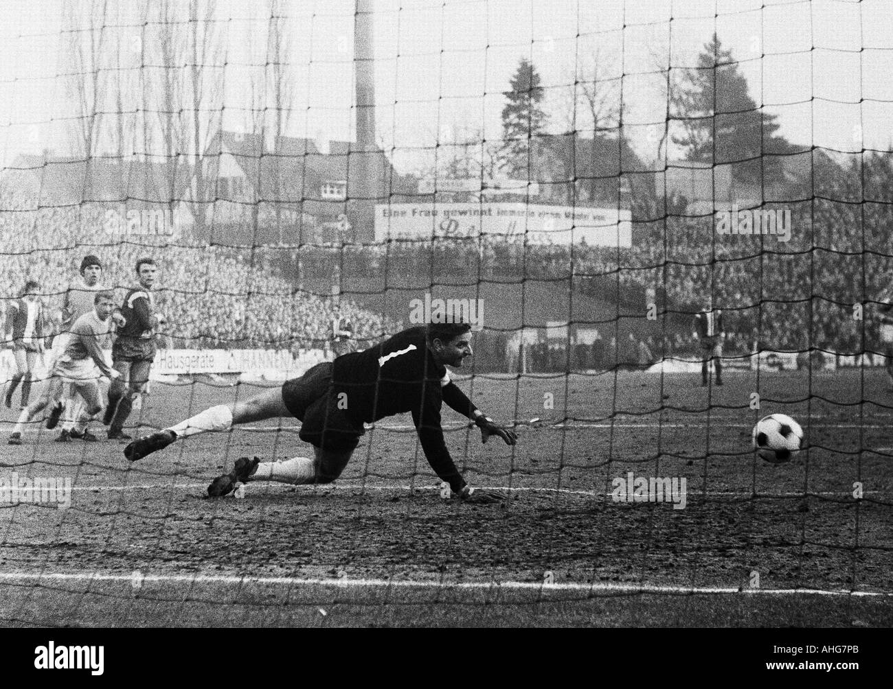 football, Bundesliga, 1969/1970, Borussia Moenchengladbach versus 1860 Munich 3:1, Boekelberg Stadium, scene of the match, f.l.t.r. Ulrik le Fevre (Gladbach), Max Reichenberger, Zeljko Perusic (both 1860), Herbert Laumen (Gladbach), Torwart Petar Radenkov Stock Photo