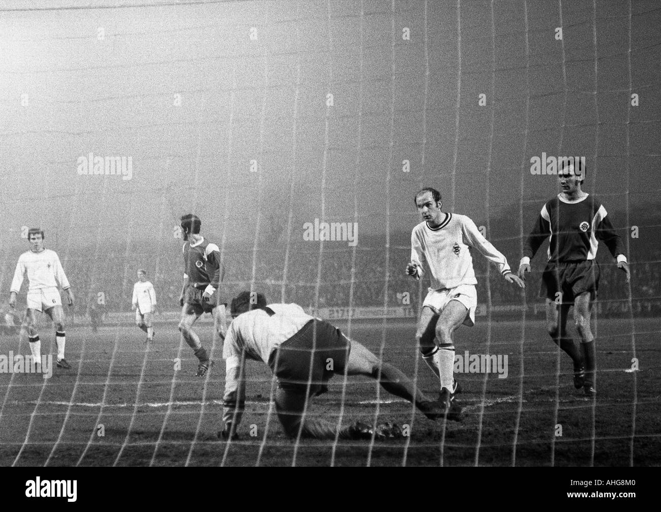 football, Bundesliga, 1969/1970, Rot-Weiss Oberhausen versus Borussia Moenchengladbach 3:4, Niederrhein Stadium in Oberhausen, scene of the match, f.l.t.r. Peter Dietrich (Gladbach), Franz Krauthausen, keeper Wolfgang Scheid (both Oberhausen), Horst Koepp Stock Photo