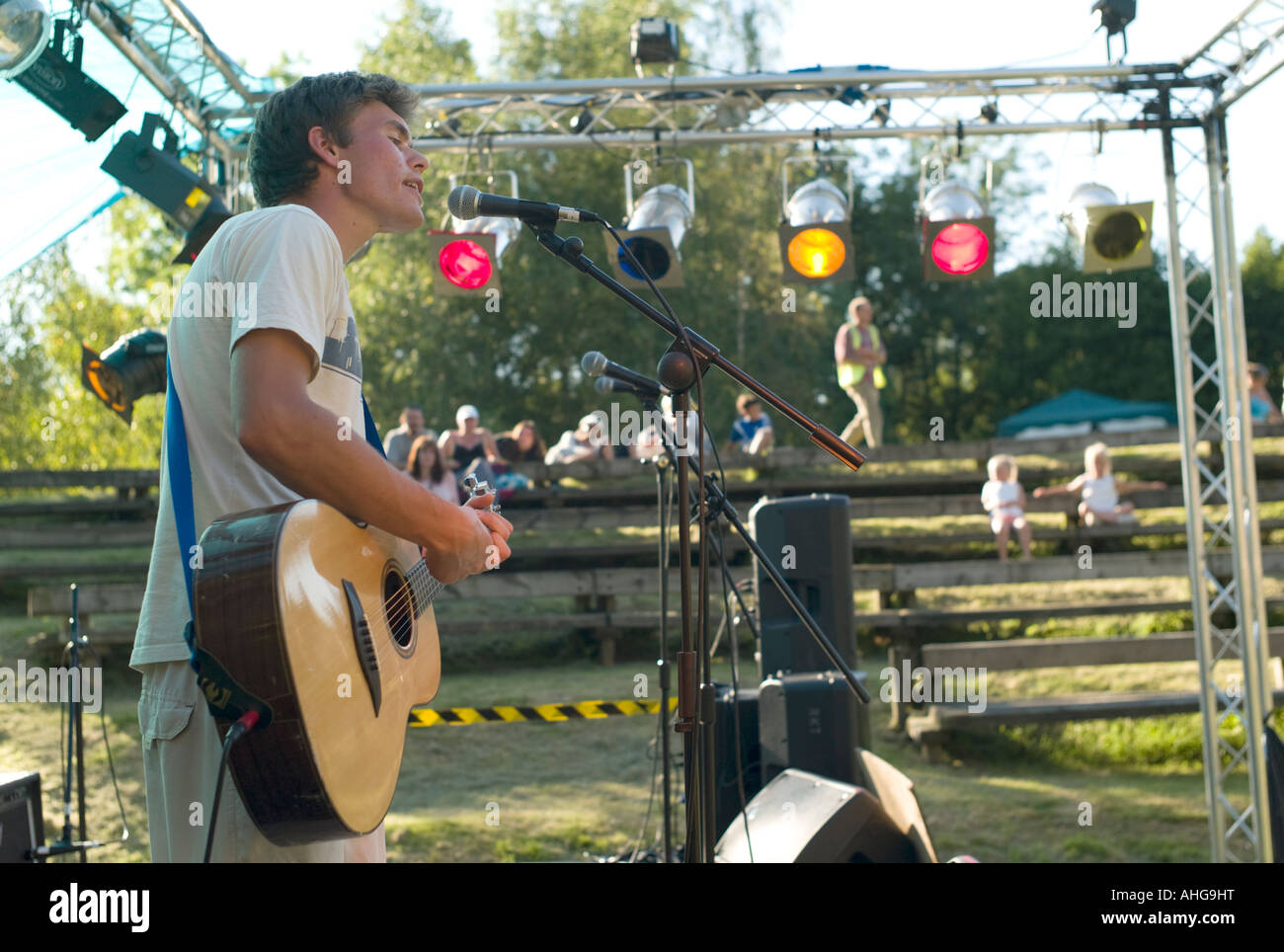 young man playing guitar and singing at 'Rock the Lake' free pop rock  outdoor concert Llandrindod Wells Powys August 2007 Stock Photo - Alamy