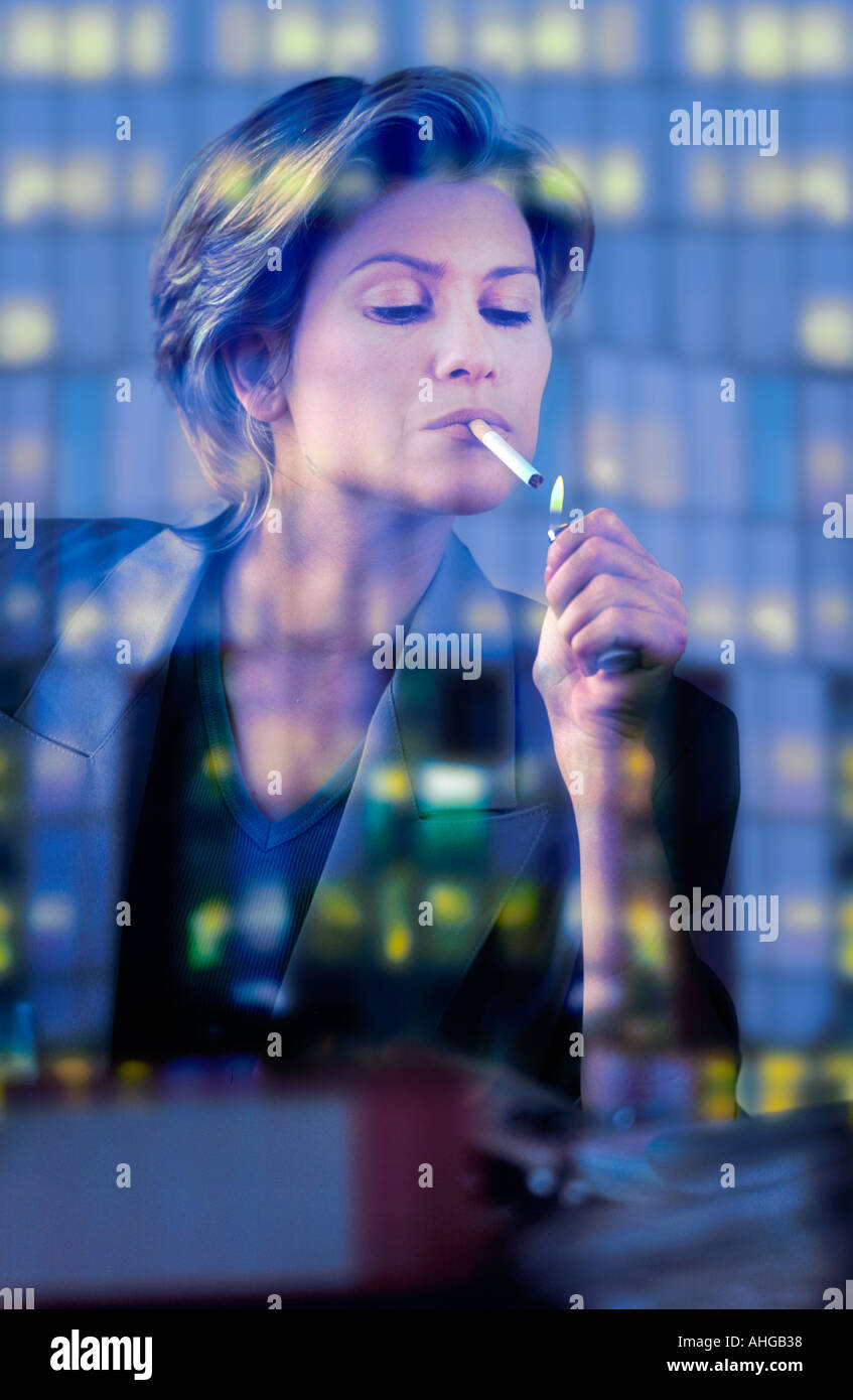 EXECUTIVE WOMAN SMOKING Stock Photo