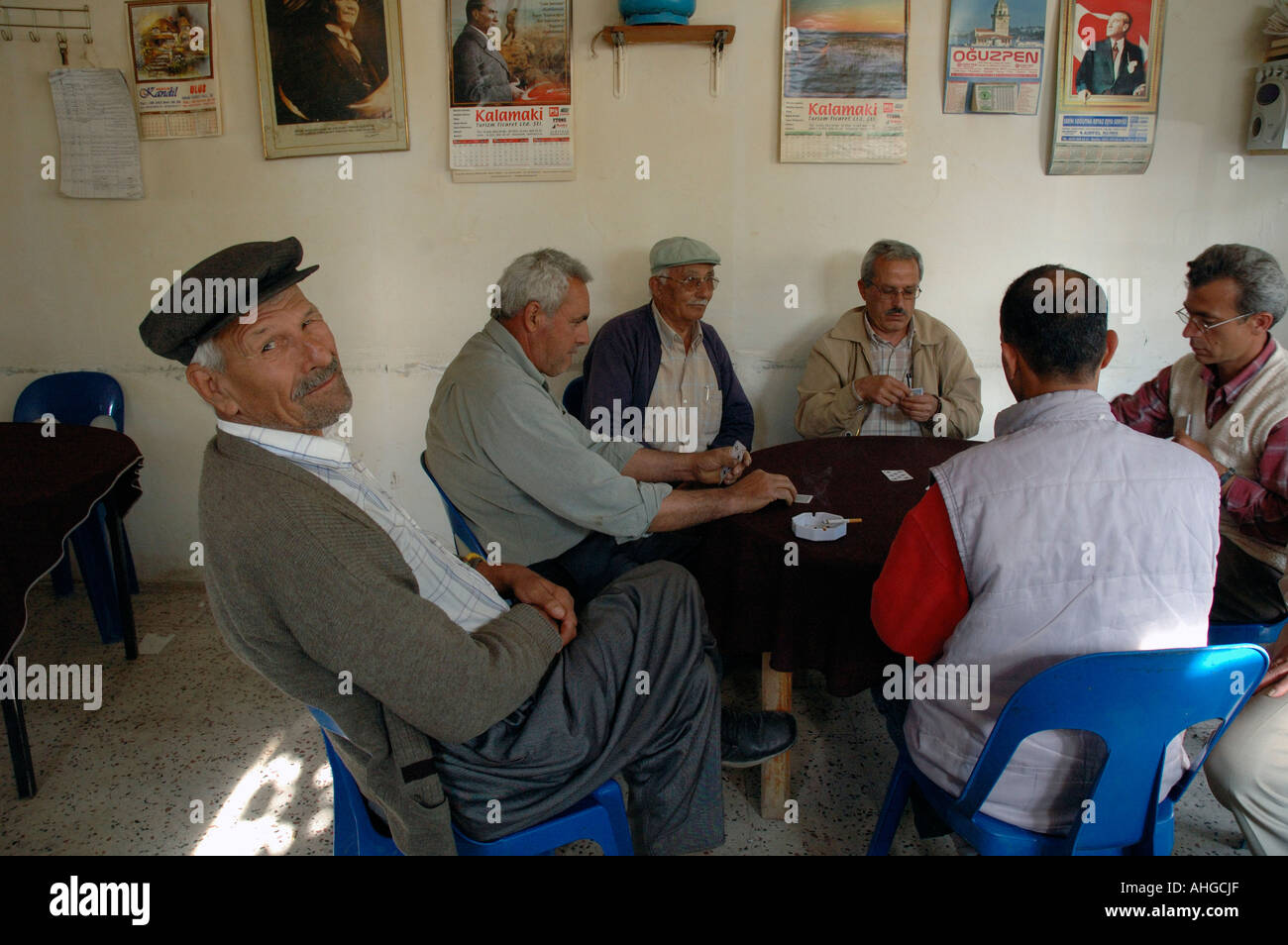 Turkish men in village cafe playing games and sitting about socialising Stock Photo
