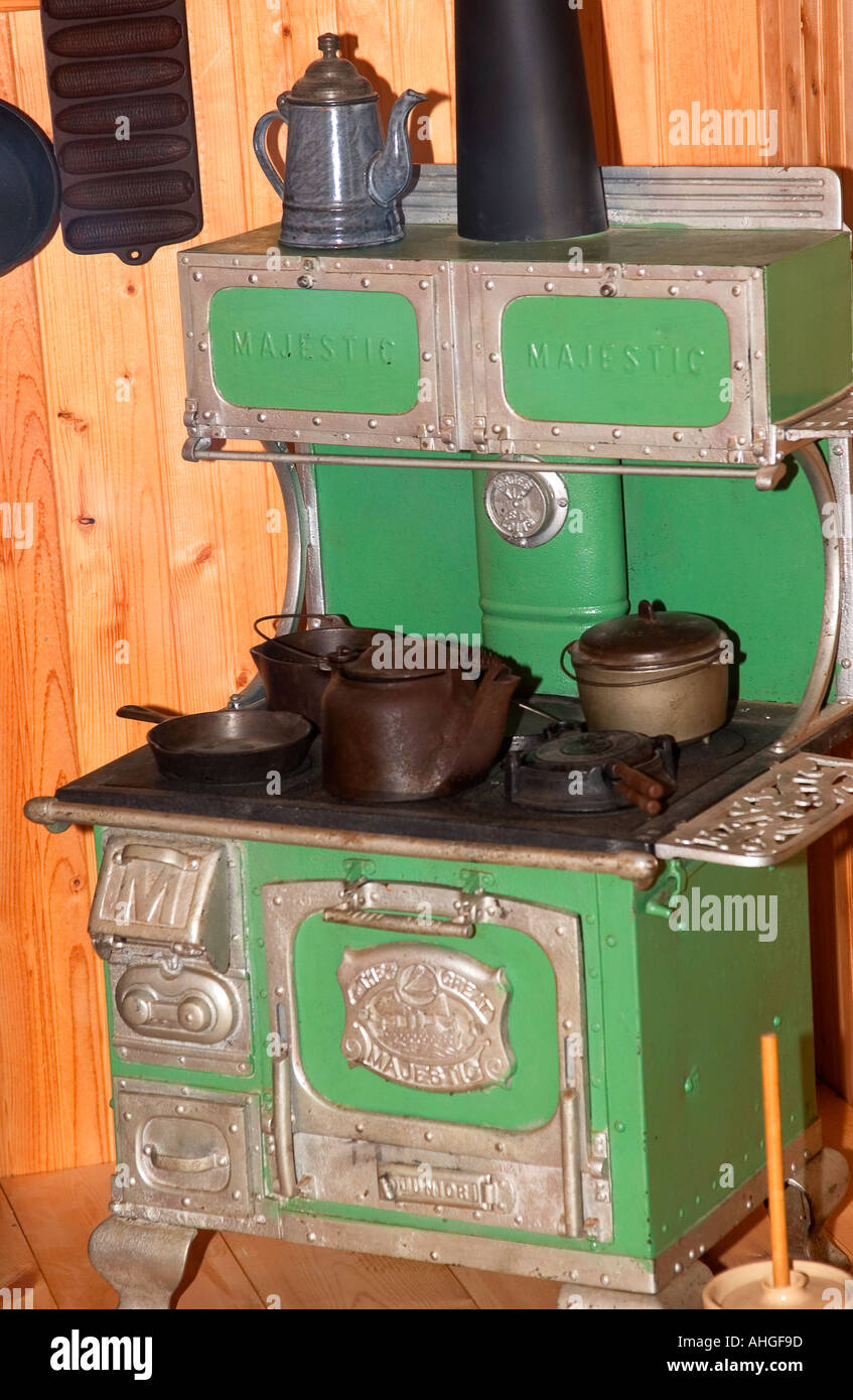 Green wood burning stove display at State Museum Columbia South Carolina USA Stock Photo