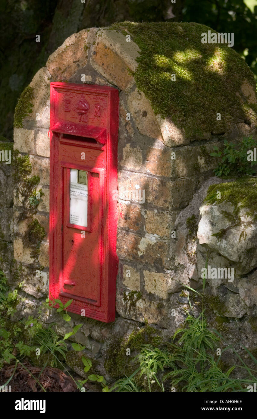 Red post box, near Torosay Castle, Isle of Mull, Scotland Stock Photo
