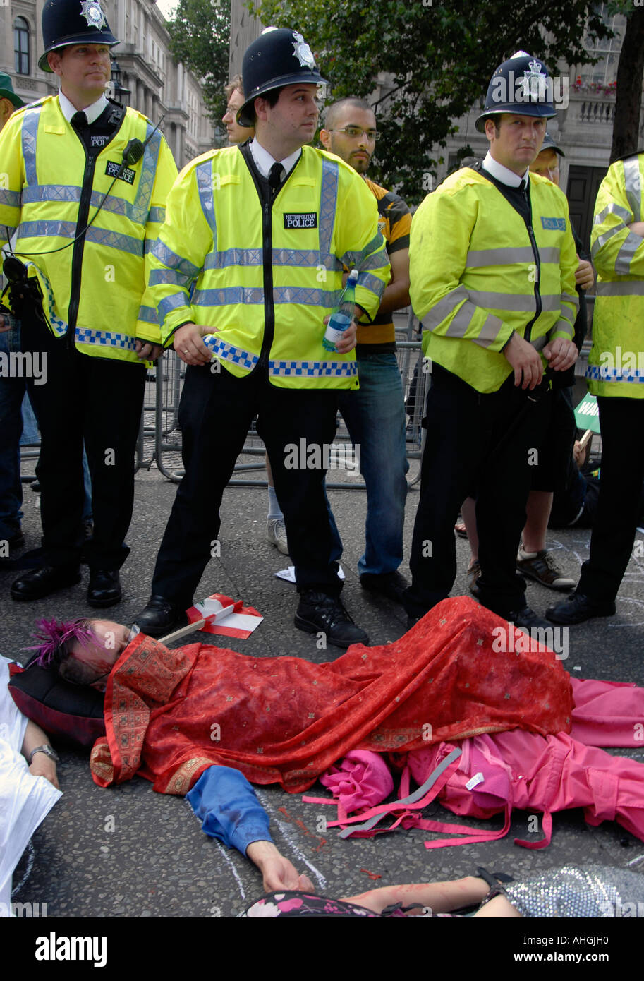 Lie down demonstration Downing Street Whitehall London when 100,000 people protest Israeli attack on Lebanon on August 5 2006. Stock Photo
