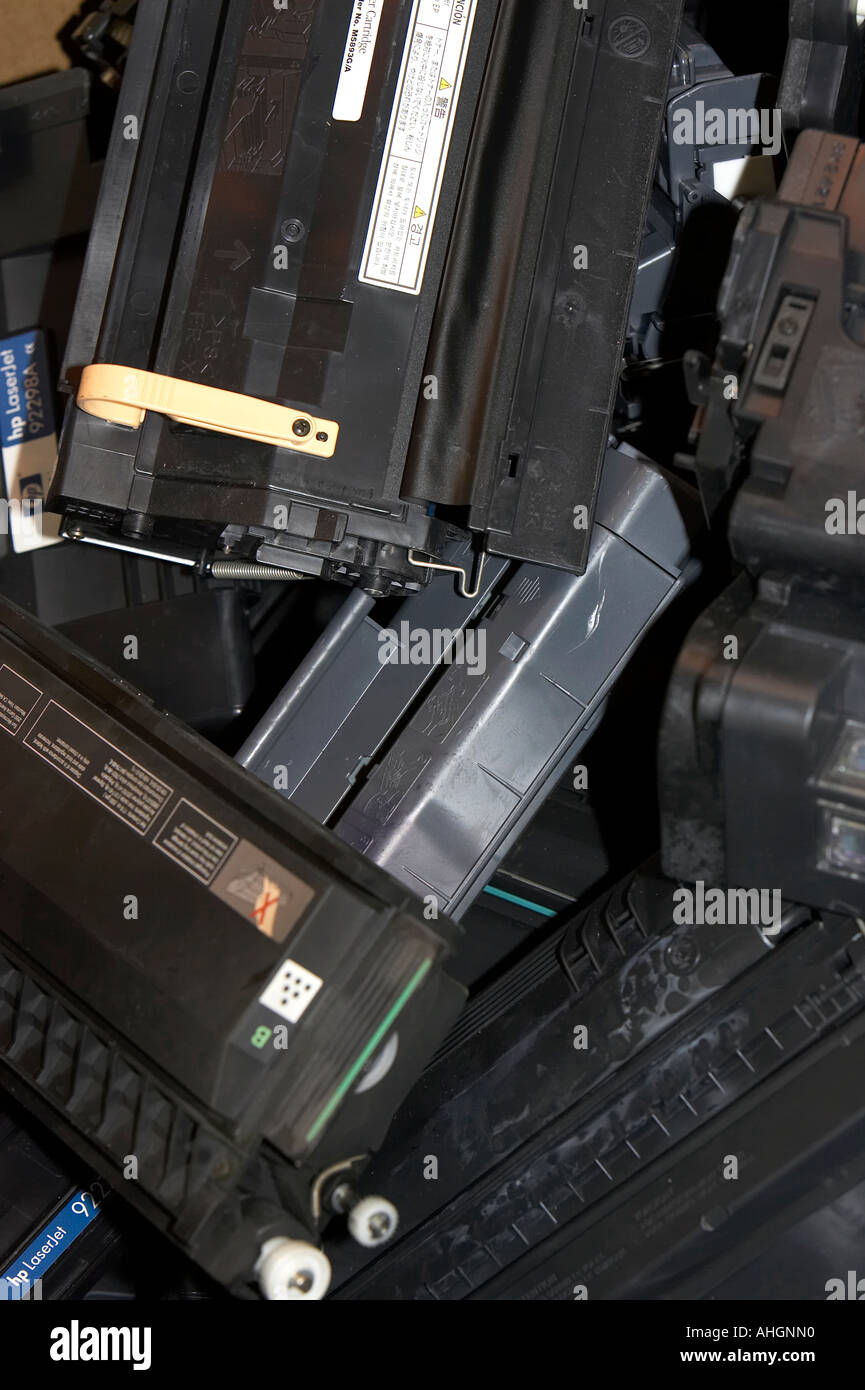 piles of computer laser printer toner cartridges ready for recycling