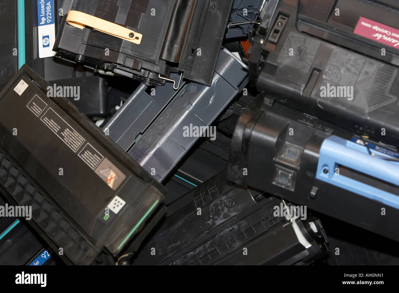 piles of computer laser printer toner cartridges ready for recycling