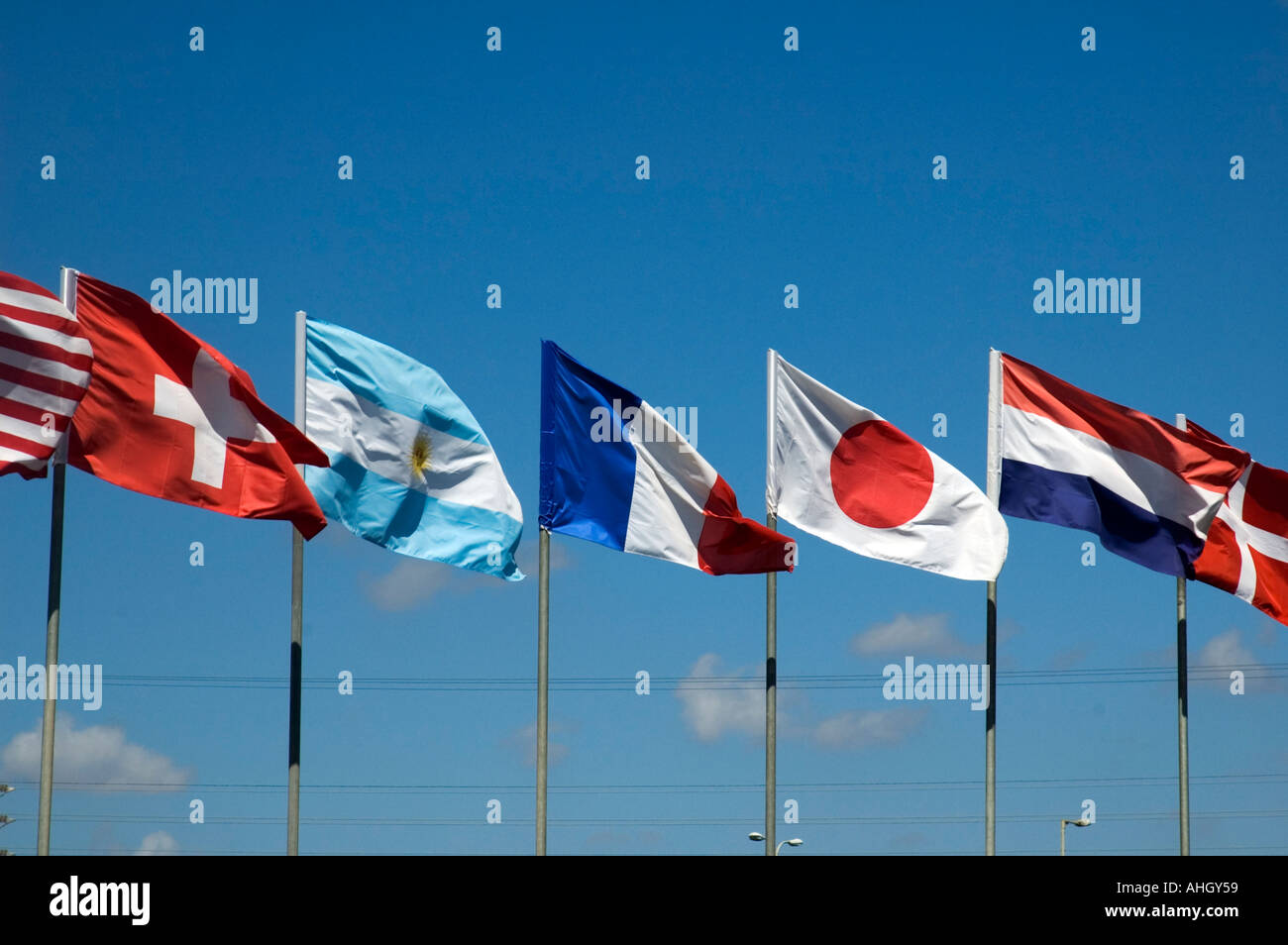 a row of 5 flags waving Stock Photo - Alamy