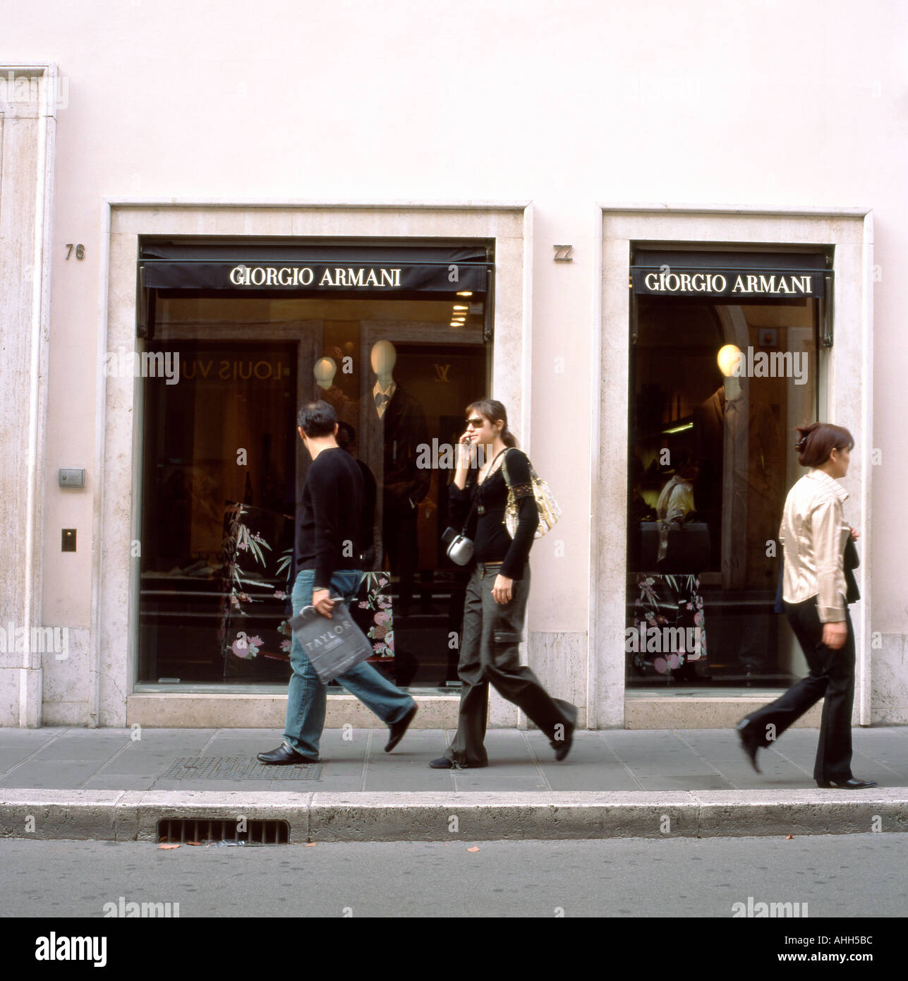 Shoppers walking past Giorgio Armani store Via Condotti, Rome, Italy  KATHY DEWITT Stock Photo