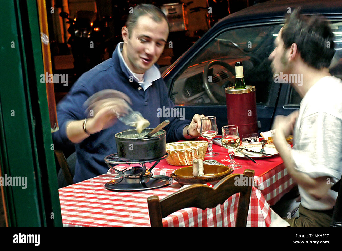 Paris France, French Restaurant "GR5" "Savoyard Region Specialty" 2 Male Friends Sharing "Cheese Fondue" on Terrace, French dining, france gastronomy Stock Photo