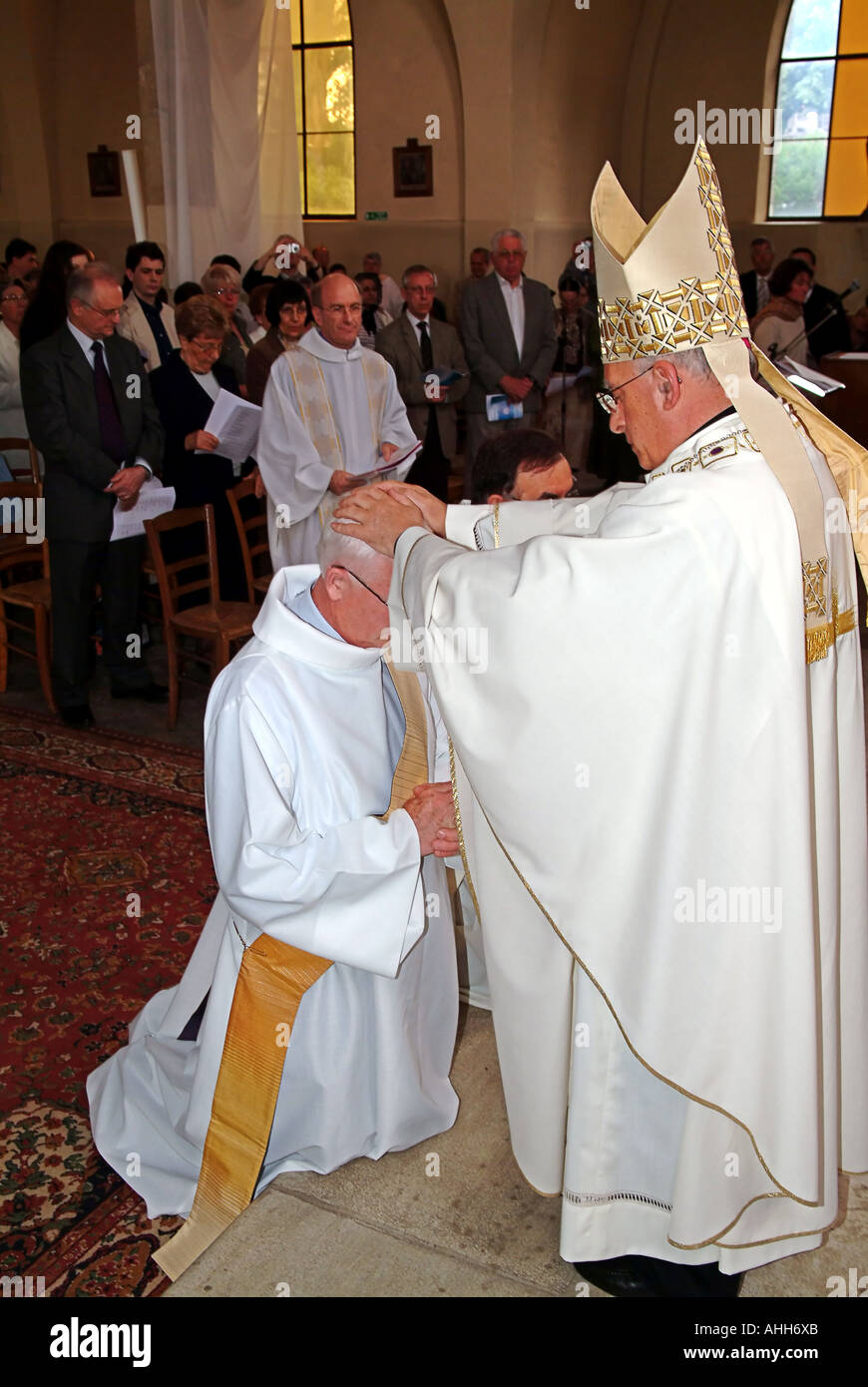 Laying on of hands during the Ordination Mass of Jean Louis Hote Focolari in St Francis de Sales Catholic Church Clamart 92 Stock Photo