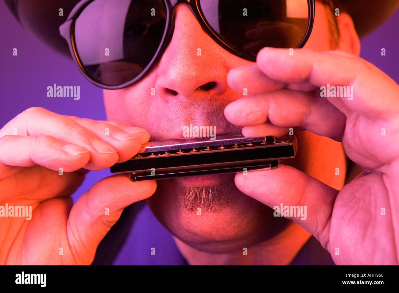 Close Up Of Hands Holding A Harmonica Stock Photo - Download Image Now -  Harmonica, Harmony, Blues Music - iStock