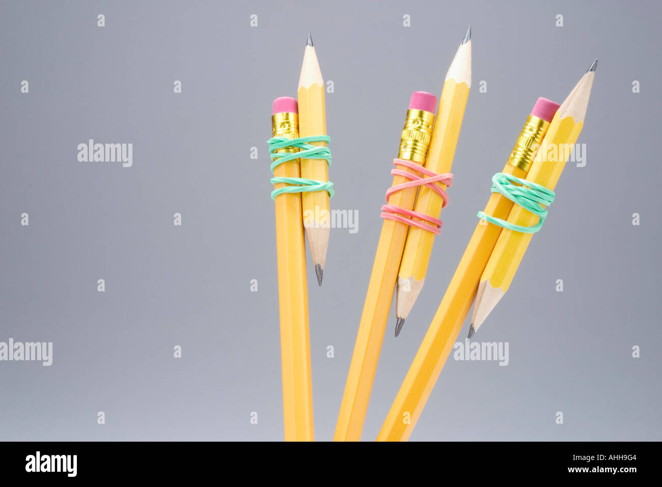 Short and Long Pencils Tied with Rubber Bands Stock Photo Alamy